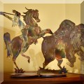 A06. Copper buffalo hunt silhouette. 